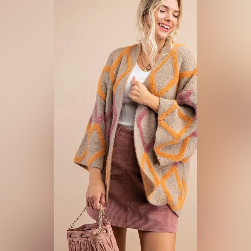 Cute cardigan with an open-front design for the perfect layering piece.